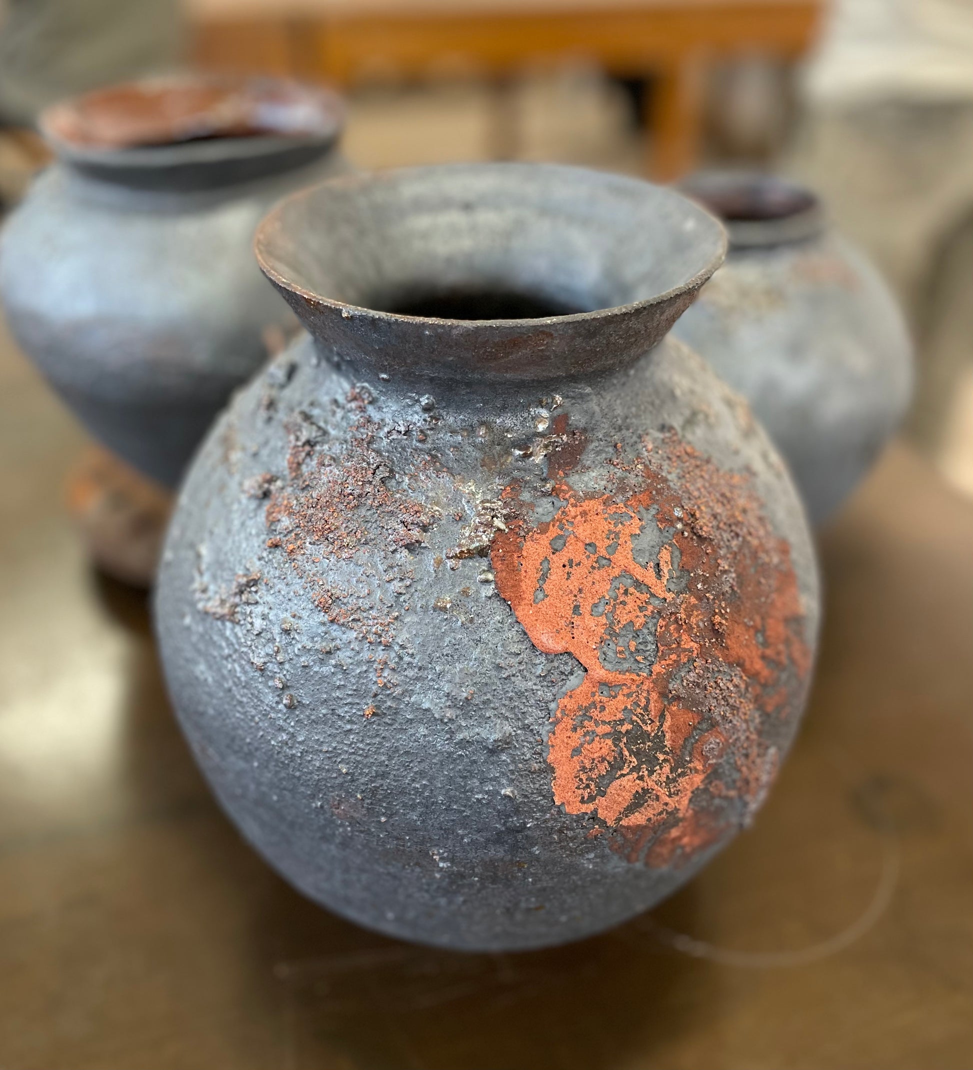 Wheel thrown with reclaimed iron rich Australian stoneware clay, this moon jar is glazed with a combination of oxides including cobalt, magnesium, copper and iron. The surface glaze is  enhanced with alumina, feldspar chips, and fireclay, creating a truly elemental sculptural and elemental piece that is one of a kind. 